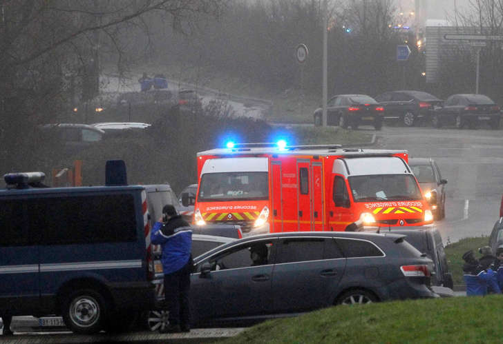 Ambulances try to make their way to Dammartin-en-Goele, northeast Paris, as part of an operation to seize two heavily armed suspects, Jan. 9, 2015.