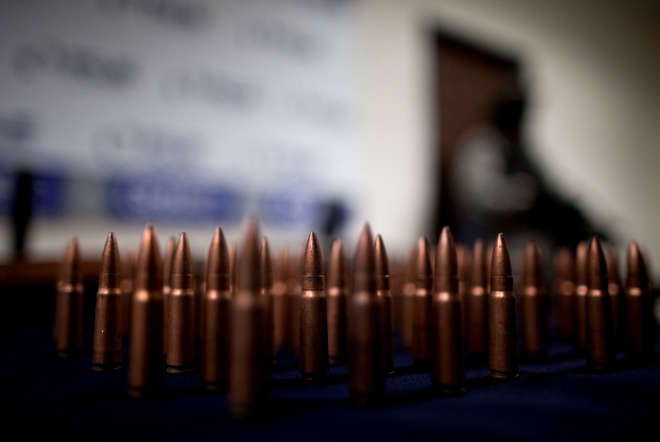 Munitions seized from alleged members of a gang of gunmen, are shown to the media in Tijuana.