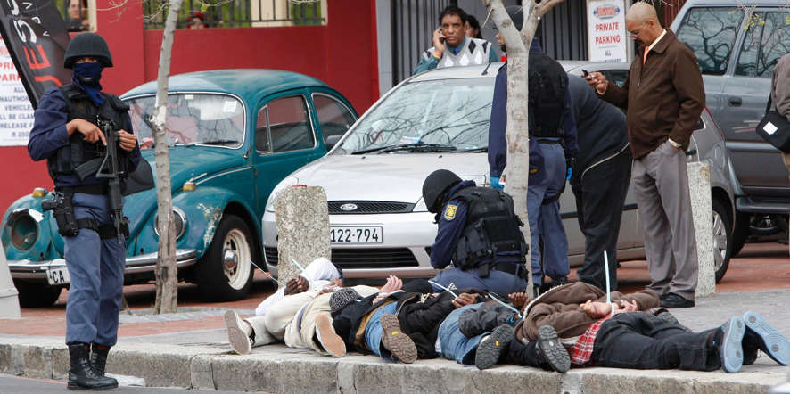 Police stand over six suspected armed robbers arrested in central Cape Town.
