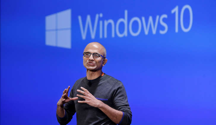 Microsoft CEO Satya Nadella speaks at an event demonstrating the new features of Windows 10 at the company's headquarters Wednesday, Jan. 21, 2015, in Redmond, Wash. Executives demonstrated how they said the new Windows is designed to provide a more consistent experience and a common platform for software apps on different devices, from personal computers to tablets, smartphones and even the company's Xbox gaming console. (AP Photo/Elaine Thompson)
