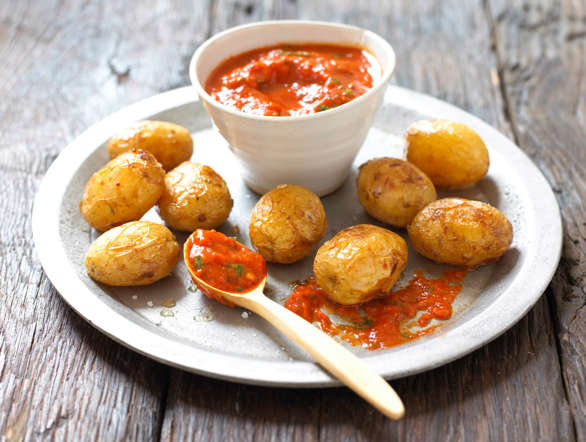 A traditional Canary Islands dish, papas arrugadas is a dish made of small potatoes served with a hot pepper sauce called mojo. The potatoes are baked and roasted with their skin, until they turn wrinkly.