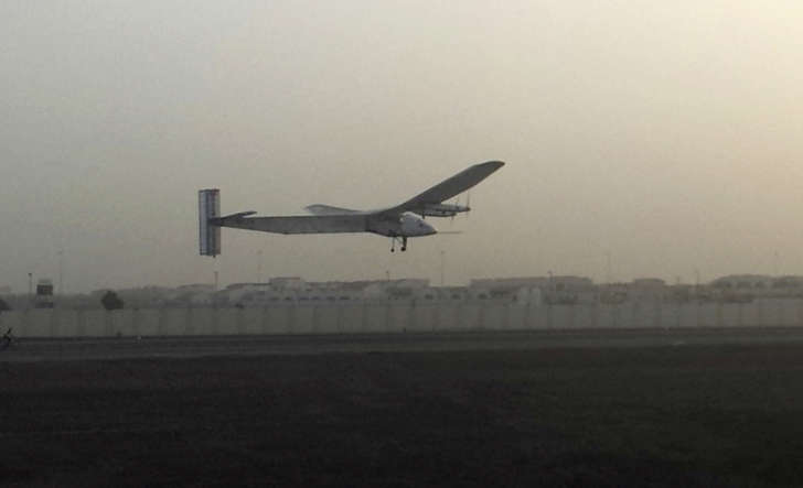 A Swiss solar-powered plane takes off at an airport in Abu Dhabi, United Arab Emirates, early Monday, March 9, 2015, marking the start of the first attempt to fly around the world without a drop of fuel. Solar Impulse founder Andre Borschberg was at the controls of the single-seater when it took off from the Al Bateen Executive Airport. Borschberg will trade off piloting with Solar Impulse co-founder Bertrand Piccard during stop-overs on a journey that will take months to complete.