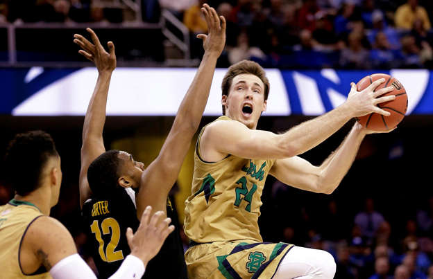 Notre Dame's Pat Connaughton goes up against Wichita State's Darius Carter during the second half in the NCAA Tournament March 26 in Cleveland. Notre Dame won 81-70.