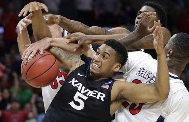Xavier forward Trevon Bluiett tries to hold on to the ball against Arizona in the NCAA Tournament March 26 in Los Angeles. Arizona won 68-60.