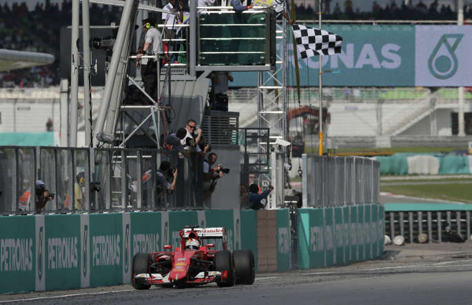 Sebatian Vettel takes the chequered flag at the Malaysia GP