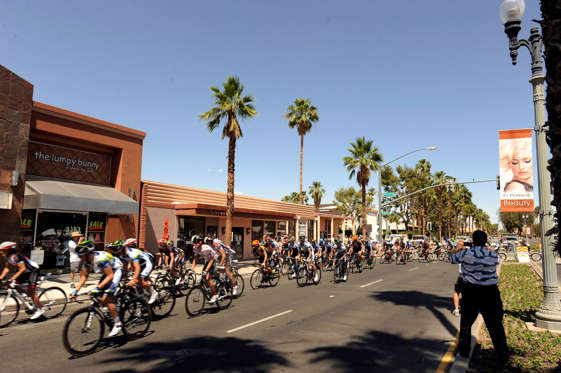 The peloton rides down El Paseo in Palm Desert, Calif., during the Amgen Tour of California Bike Race on Monday, May 13, 2013. This was Stage 2 of the race which started in Murrieta, Calif., and finished in Palm Springs, Calif. (AP Photo/ Rodrigo Pena)