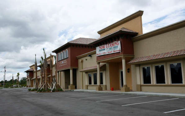 A shopping center with for lease signs is shown Tuesday, May 19, 2009 in Lehigh Acres, Fla. (AP Photo/Wilfredo Lee)