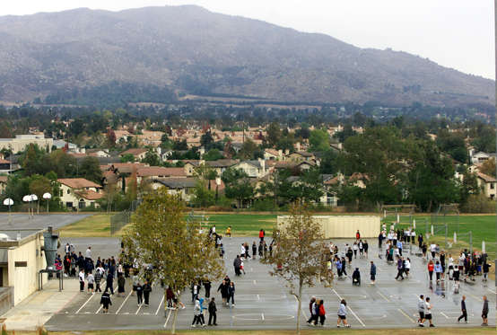 RETRANSMISSION TO CORRECT DATE FROM NOV. 29 TO NOV. 30--Youngsters play outside the Vista Heights Middle School Friday, Nov. 30, 2001 in Moreno Valley, Calif. New housing developments since the 1980's brought persons of many races from Los Angeles, and San Diego to Moreno Valley. (AP Photo/Damian Dovarganes)