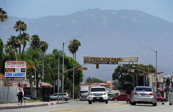 Mount Wilson observatory sits atop the San Gabriel Mountains behind the city of El Monte, California on June 19, 2014, where a banner announces a free job fair. Frederic J. Brown/AFP/Getty Images