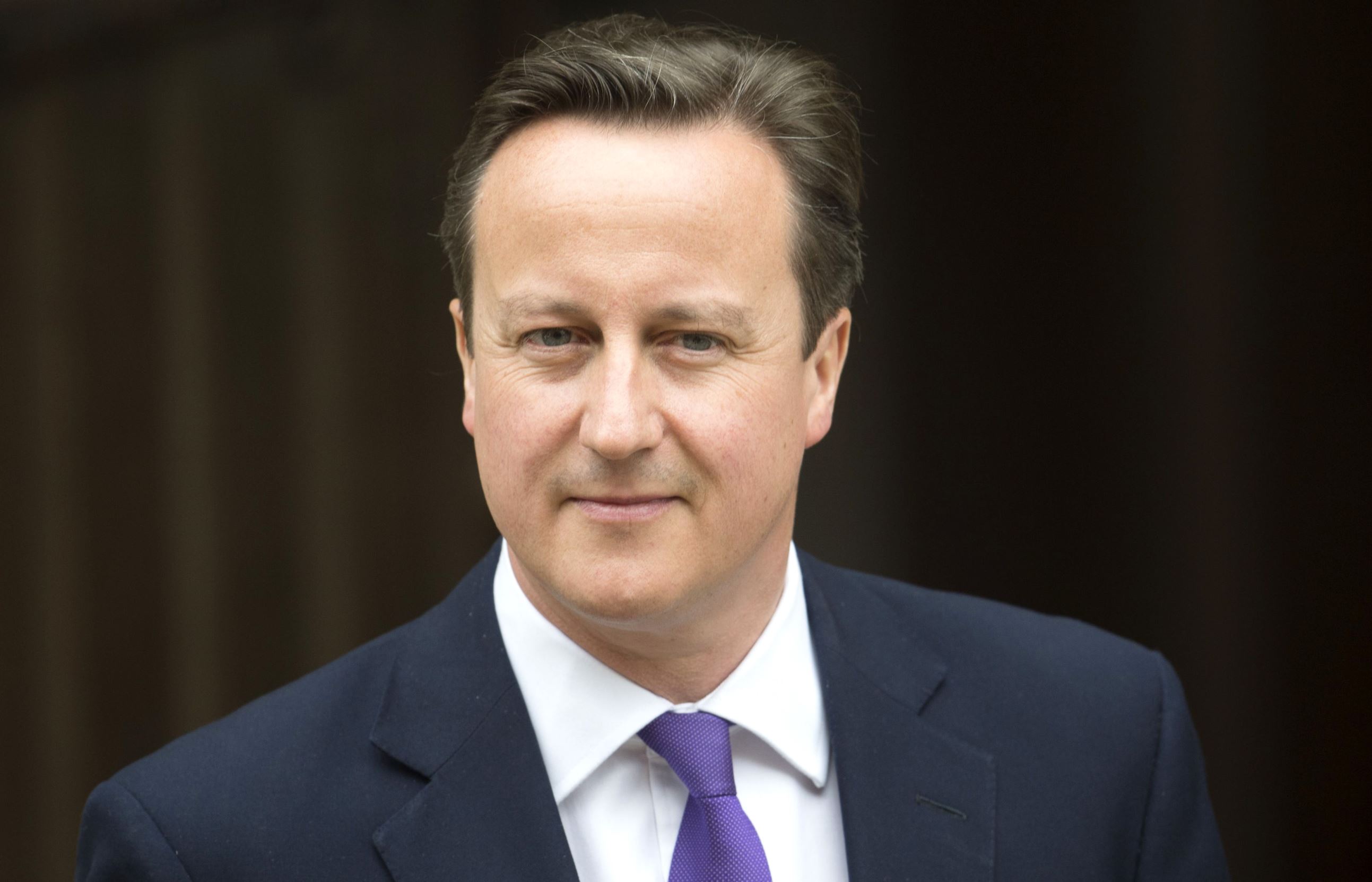 David Cameron leaves after giving evidence.