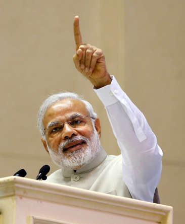 India's Prime Minister Narendra Modi points as he speaks at the inaugural session of Re-Invest 2015, the first Renewable Energy Global Investors Meet & Expo, in New Delhi, February 15, 2015