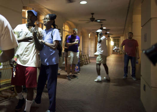 People concerned about relatives seek information from police nearby the scene of a shooting at the Emanuel AME Church in Charleston, South Carolina, June 17, 2015. A gunman opened fire on Wednesday evening at the historic African-American church in downtown Charleston.