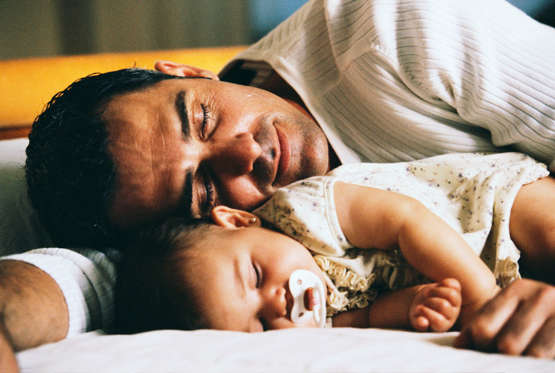 Father and Infant Daughter Sleeping
