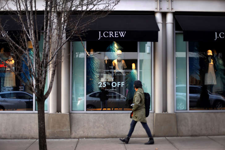 Pedestrian passing in front of a J.Crew store in Pittsburgh