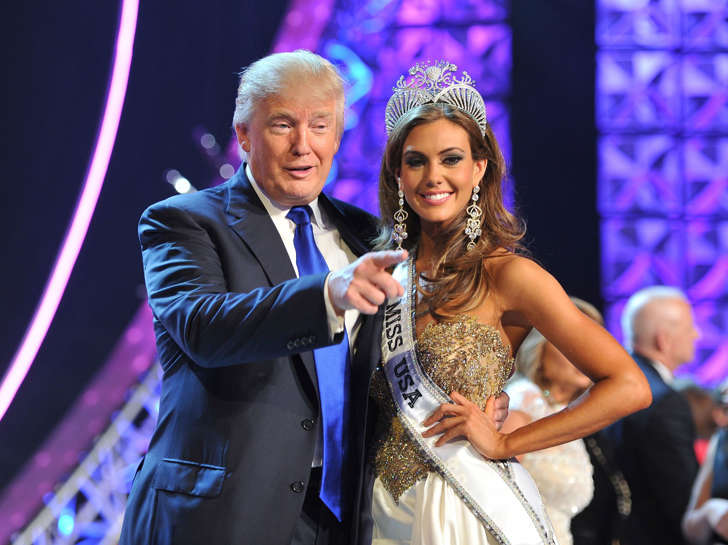 FILE - In this June 16, 2013 file photo, Donald Trump, left, and Miss Connecticut USA Erin Brady pose onstage after Brady won the 2013 Miss USA pageant in Las Vegas, Nev. Univision says it is dropping the Miss USA Pageant and says it will cut all business ties with Donald Trump over comments he made about Mexican immigrants. The network said Thursday, June 25, 2015, it will not air the pageant on July 12, as previously scheduled, and has ended its business relationship with the Miss Universe Organization due to what it called "insulting remarks about Mexican immigrants" by Trump, a part owner.