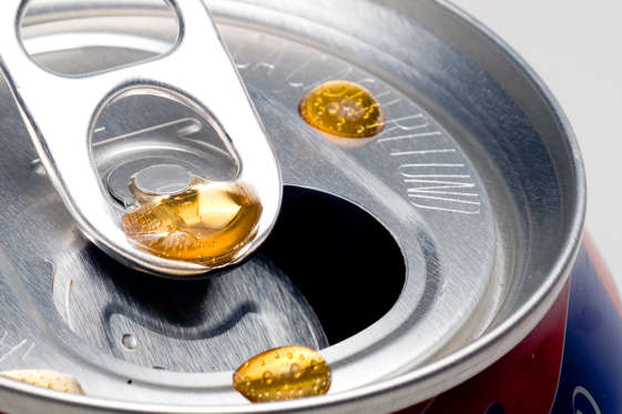 Drops of cola on a can.