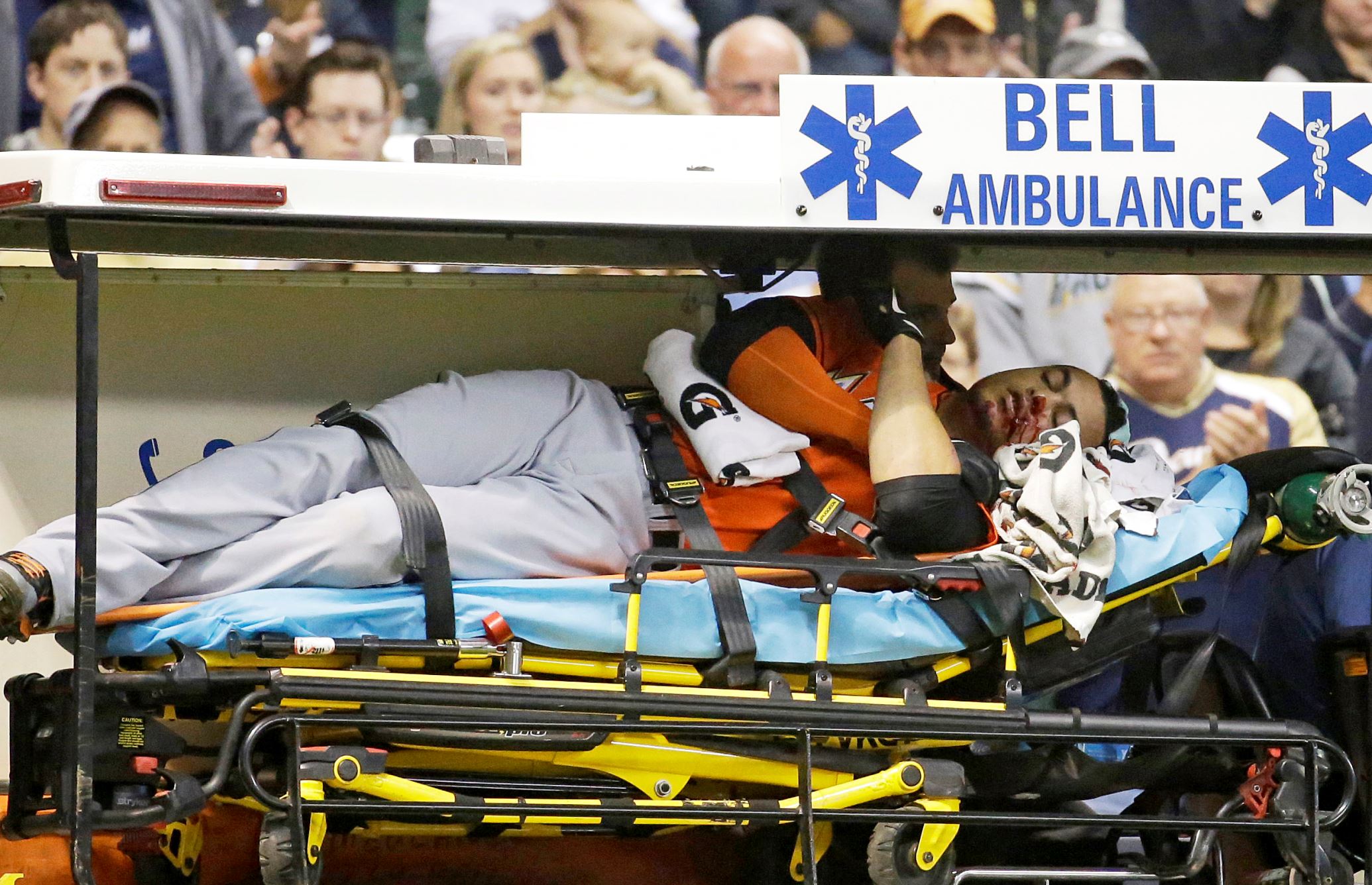 Miami Marlins' Giancarlo Stanton is taken off the field on a stretcher after being hit in the face with a pitch during the fifth inning against the Milwaukee Brewers Sept. 11 in Milwaukee.