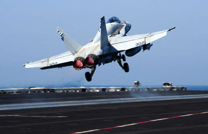 An F/A-18C Hornet assigned to the Valions of Strike Fighter Squadron 15 launches from the flight deck of the aircraft carrier USS George H.W. Bush on Sept. 15.
