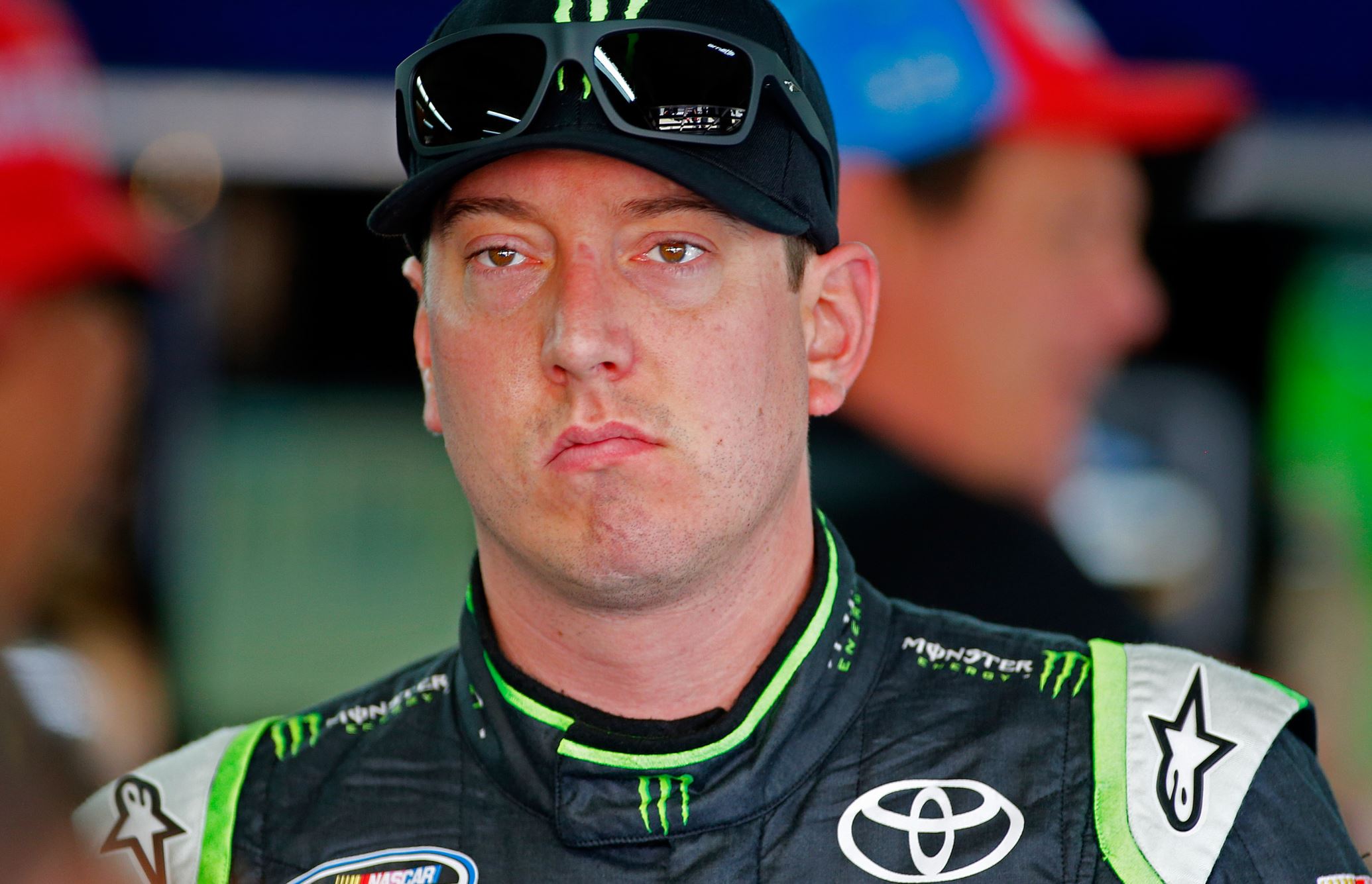 Kyle Busch waits by his car before practice for Sunday's NASCAR Sprint Cup series Coca-Cola 600 auto race at Charlotte Motor Speedway in Concord, N.C., Saturday, May 24, 2014.