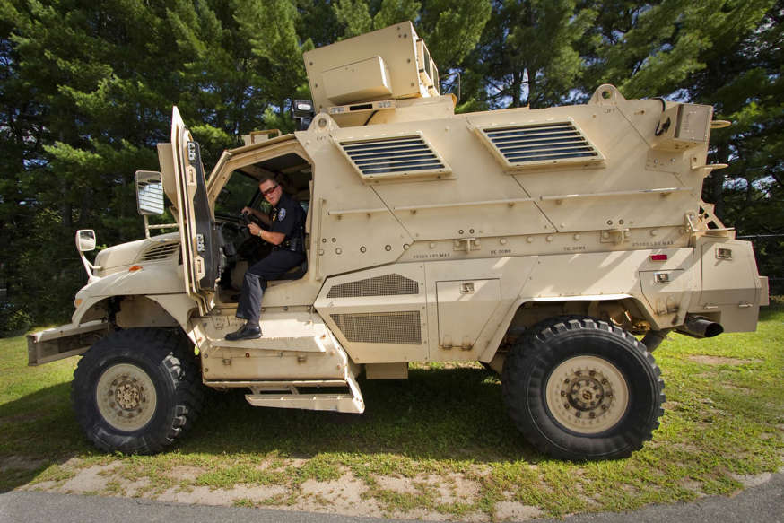 Sanford Police Chief Thomas Connolly steps down from the department's Mine-Resistant Ambush Protected (MRAP) vehicle.