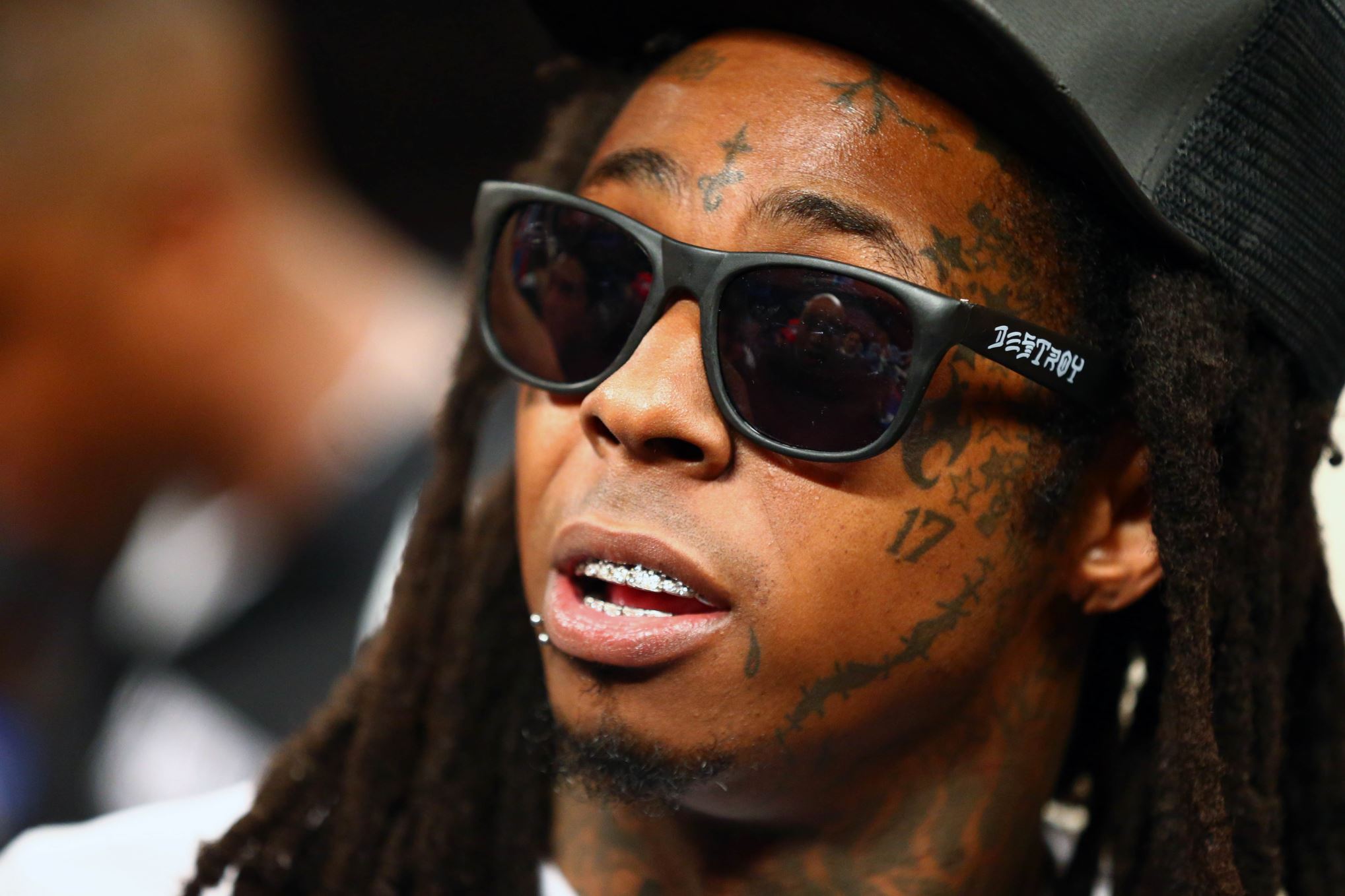 The rapper or AKA Weezy was sentenced to five months in prison for having marijuana and illegal weapons on his tour bus.