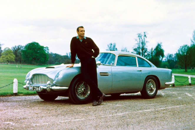 Movie: Goldfinger (1964), Thunderball (1965)

Before he drove it in Casino Royale later on, Bond the DB5 in Goldfinger and Thunderball. To the car, an ejector seat, machine guns, a smoke screen, and tyre slashers were added.