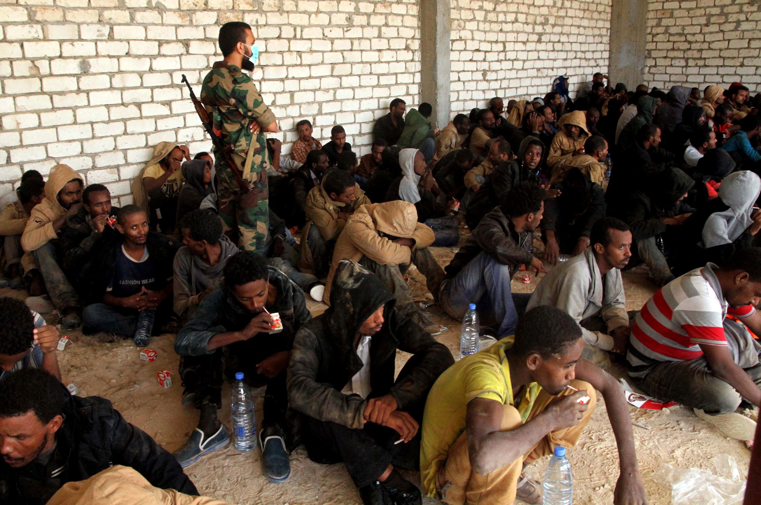 About 200 migrants, mostly from Ethiopia and Eritrea, have been detained in the coastal town of Zawiya, west of Tripoli as they tried to cross to Europe in a truck on June 1, 2014.