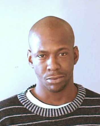 Singer Bobby Brown is shown in this handout booking photograph on January 17, 2003 in Decatur, Georgia. Brown turned himself in to the police after a DeKalb County Judge issued a bench warrant for the singer's arrest. Brown was wanted by police after he failed to appear in court to face charges stemming from a previous arrest for driving under the influence.