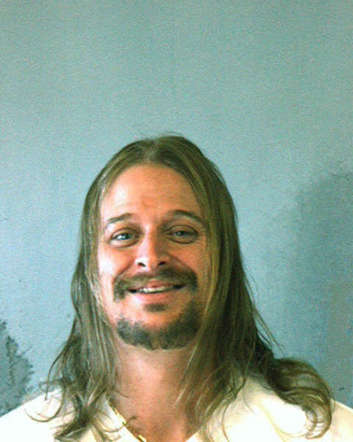 In this police mug shot from the DeKalb County Sheriff's Office, musician Kid Rock, or Robert J. Ritchie, poses for a mug shot October 21. 2007 in DeKalb County, Georgia. Kid Rock was arrested in the early morning of October 21 after a fight at a Waffle House restaurant in DeKalb County.
