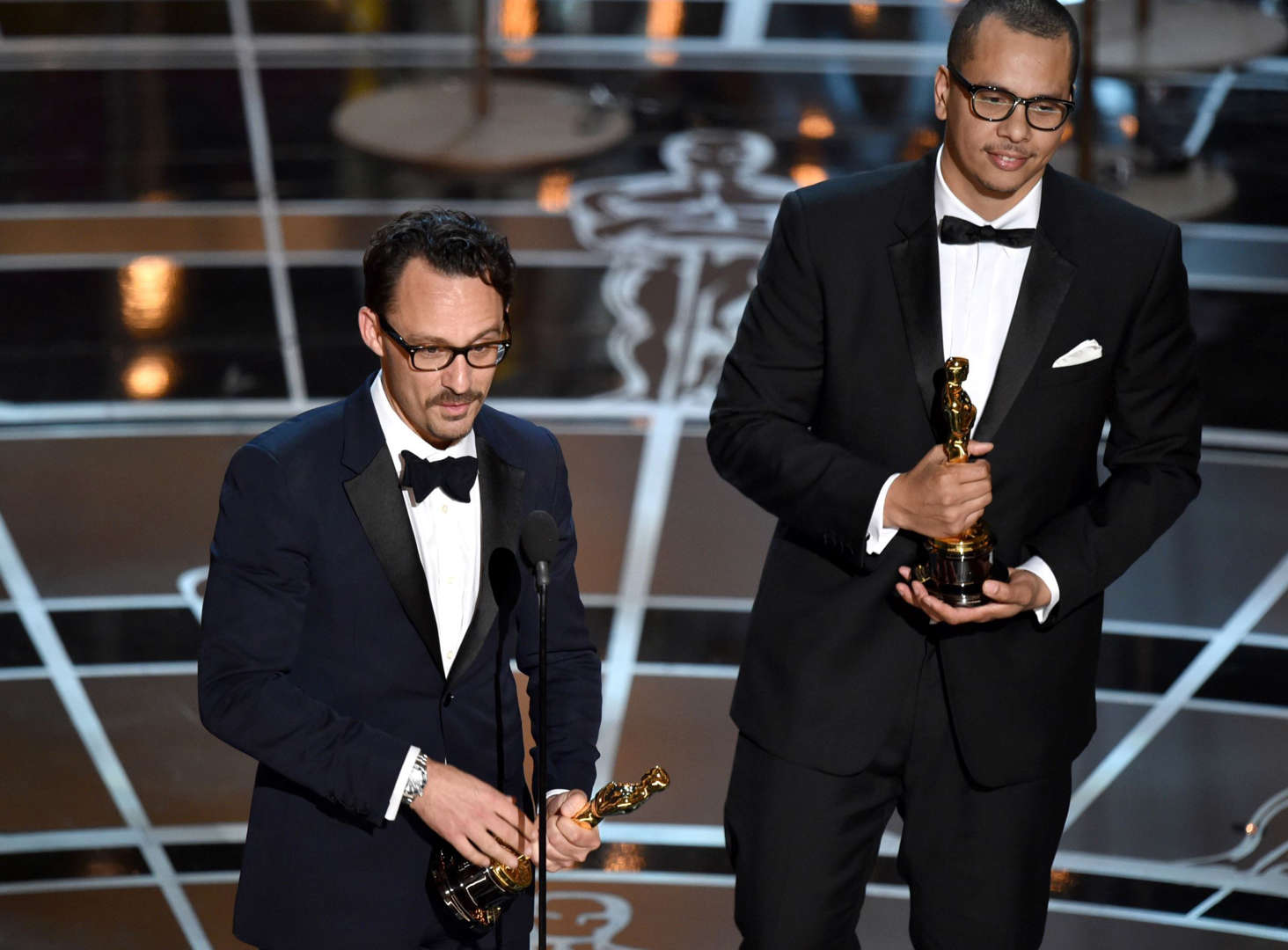 Mat Kirkby, left, and James Lucas accept the award for best live action short film for “The Phone Call” at the Oscars on Sunday, Feb. 22, 2015, at the Dolby Theatre in Los Angeles. (Photo by John Shearer/Invision/AP)