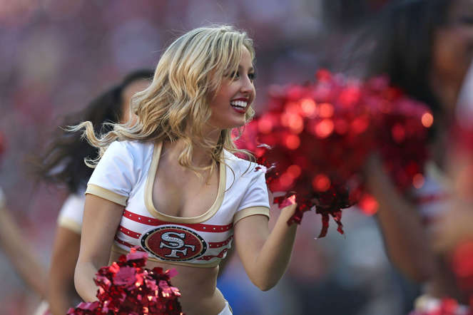 A member of the Gold Rush Cheerleaders rallies the crowd against the Arizona Cardinals at Levi's Stadium on December 28, 2014 in Santa Clara, California.