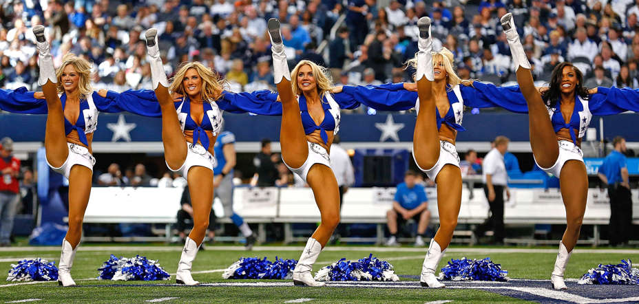 The Dallas Cowboys Cheerleaders perform during the first half of their NFC Wild Card Playoff game against the Detroit Lions at AT&T Stadium on January 4, 2015 in Arlington, Texas.