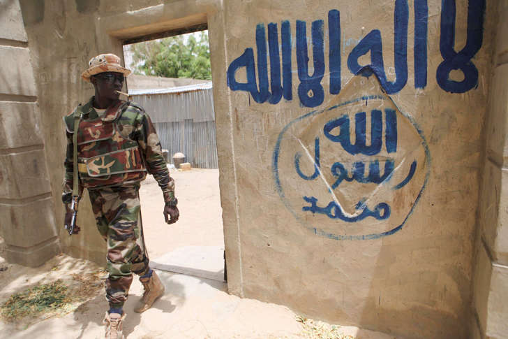A Nigerien soldier walks out of a house that residents say a Boko Haram militant had forcefully seized and occupied in Damasak March 24, 2015. Boko Haram militants have kidnapped more than 400 women and children from the northern Nigerian town of Damasak that was freed this month by troops from Niger and Chad, residents said on Tuesday. Nigerian, Chadian and Niger forces have driven militants out of a string of towns in simultaneous offensives over the past month.