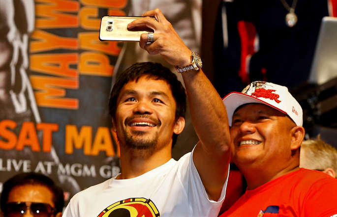 Manny Pacquiao takes a selfie during his official weigh-in on May 1 at MGM Grand Garden Arena in Las Vegas.