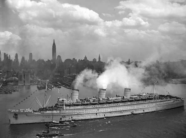 The British liner RMS Queen Mary arrives with thousands of U.S. troops from Europe, in New York harbor on June 20, 1945, in this handout photo provided by the U.S. Navy. Seventy years ago, following the suicide of Nazi leader Adolf Hitler, Germany's head of state Karl Donitz signed his country's surrender to Allied forces in Reims, France on May 7, 1945 and in Berlin on May 8, 1945.