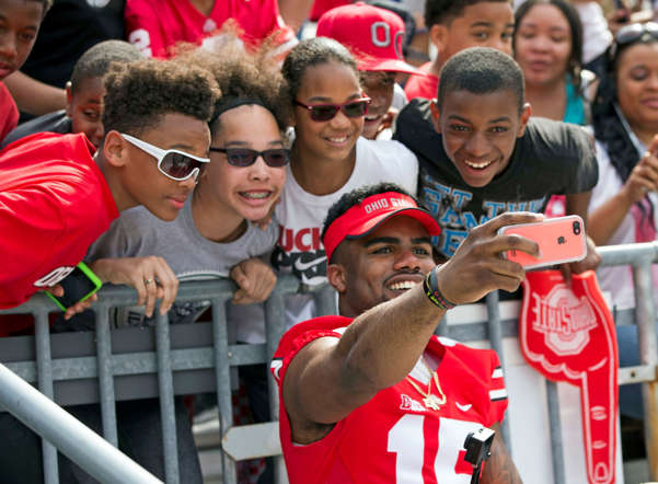 Ohio State Buckeyes running back Ezekiel Elliott takes a selfie with fans during the Ohio State Spring Game on April 18, 2015, at Ohio Stadium in Columbus, Ohio.