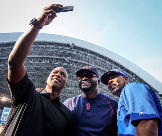 (From left) Former MLB player Carlos Delgado takes a selfie with David Ortiz of the Boston Red Sox and Edwin Encarnacion of the Toronto Blue Jays before a game between the Blue Jays and the Red Sox on May 8, 2015, at the Rogers Centre in Toronto.