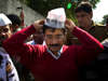 File: Aam Aadmi Party, or Common Man Party, leader Arvind Kejriwal, adjusts his cap while campaigning ahead of Delhi state elections in New Delhi, India