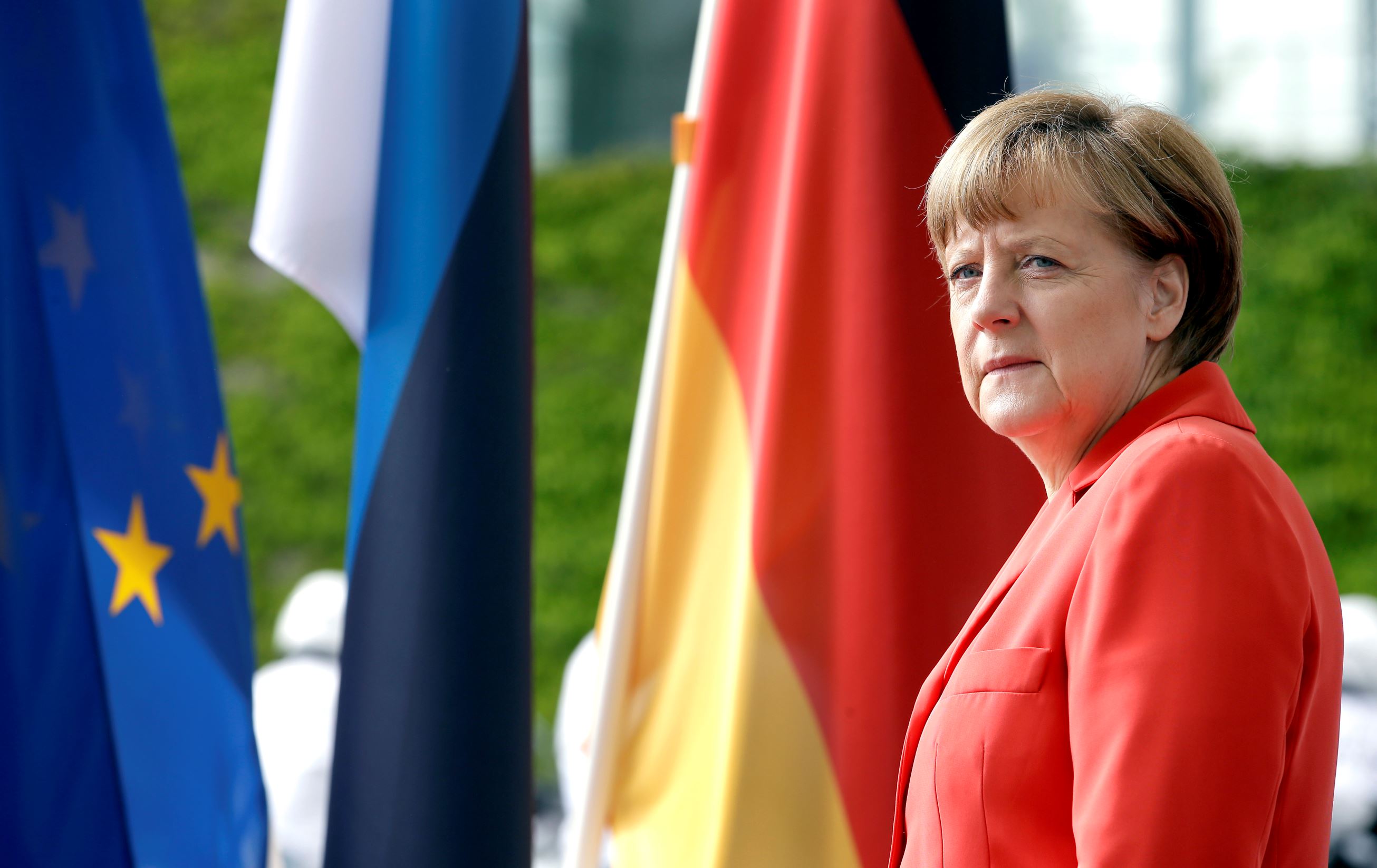 German Chancellor Angela Merkel waits for the arrival of Estonia's President Toomas Hendrik Ilves for a meeting at the chancellery in Berlin, Germany Tuesday, May 19, 2015. (AP Photo/Michael Sohn)