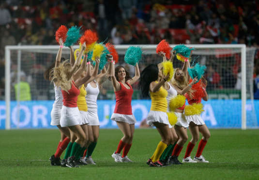 Cheerleaders entertain the spectators before the World Cup qualifying playoff first leg soccer match between Portugal and Sweden Friday, Nov. 15 2013, at the Luz stadium in Lisbon.
