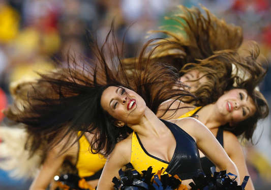 Hamilton Tiger-Cats cheerleaders perform during a break in play against the Edmonton Eskimos during the first half of their CFL football in Hamilton, September 20, 2014.