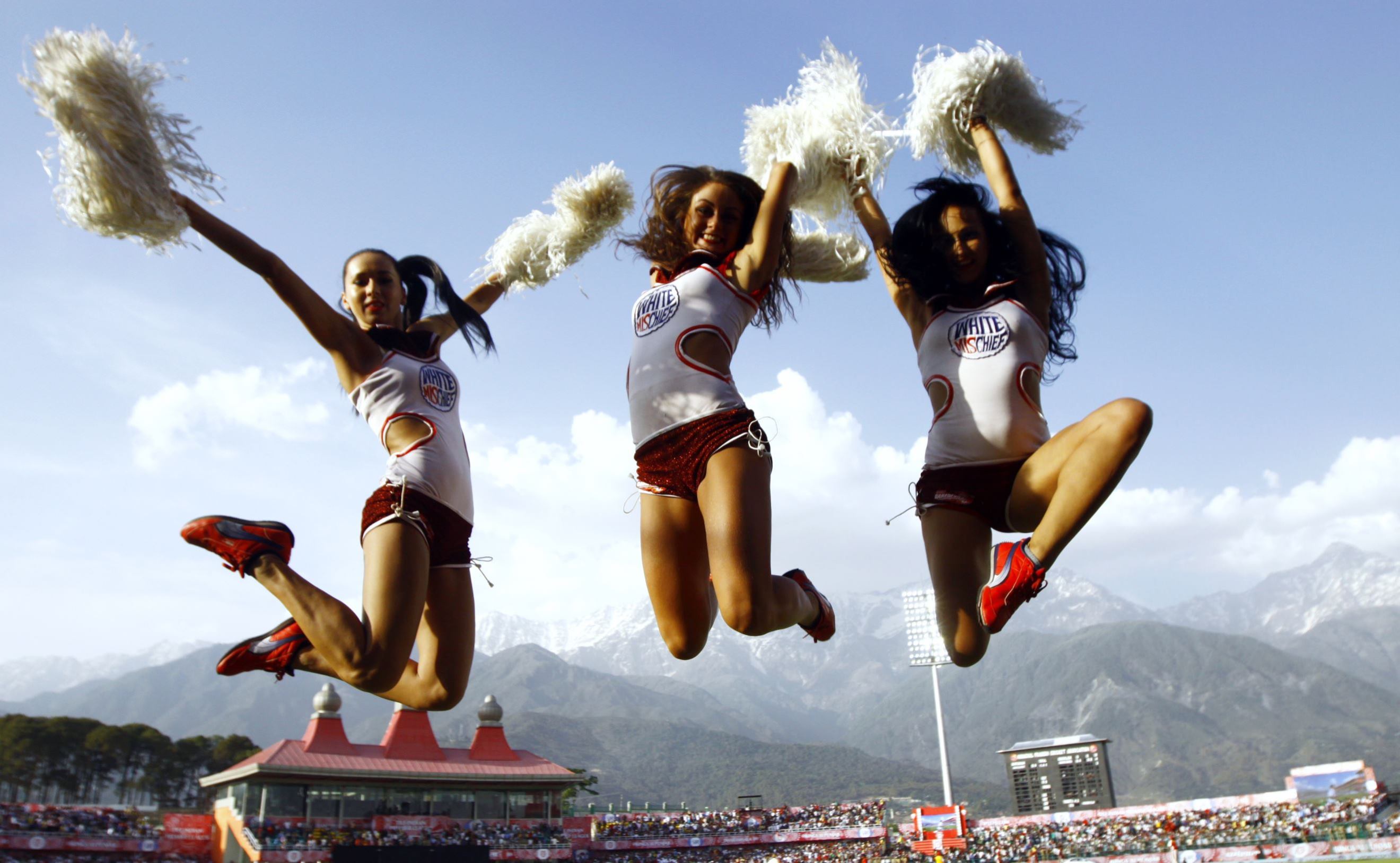 PL cheerleaders perform for the Delhi Daredevils during the IPL Twenty20 cricket match between Kings XI Punjab and Delhi Daredevils at Himachal Pradesh Cricket stadium in Dharamsala on May 19, 2012..