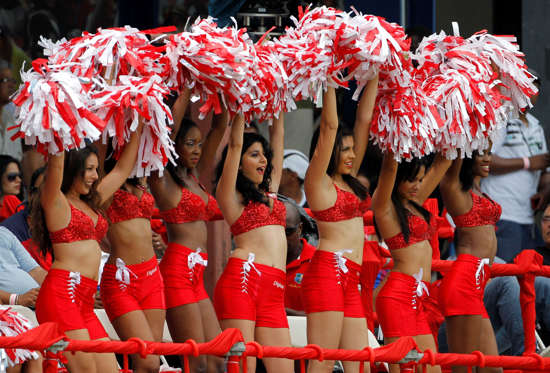 Cheerleaders entertain the crowd during the Twenty20 international cricket match between India and the West Indies in Port of Spain, Trinidad, Saturday June 4, 2011.