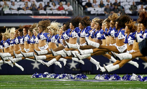 The Dallas Cowboys Cheerleaders during preseason action against the Baltimore Ravens in preseason action on Saturday, Aug. 16, 2014, at AT&T Stadium in Arlington, Texas. (