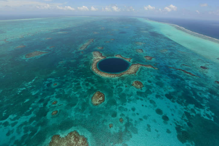 The Great Blue Hole, a popular diving site that is part of Belize’s barrier reef