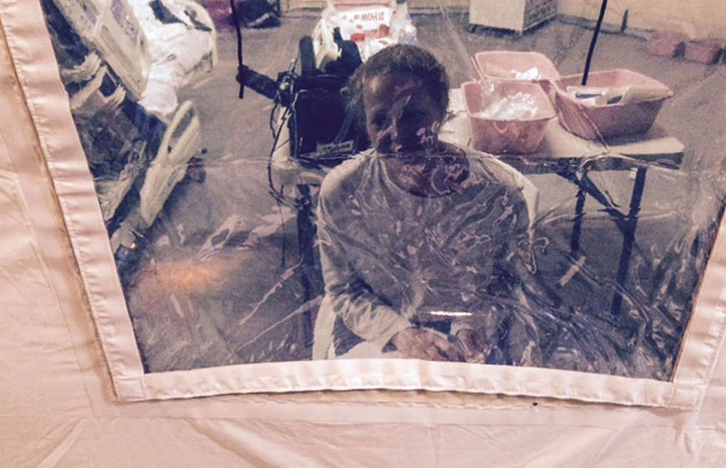 Kaci Hickox speaks to her lawyer Norman Siegel from a hospital quarantine tent in Newark, New Jersey, October 26, 2014.