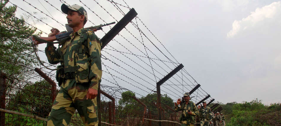 File: India's Border Security Force (BSF) soldiers patrol along the fencing of the India-Bangladesh international border ahead of the general election on the outskirts of Agartala, capital of India's northeastern state of Tripura April 4, 2014.
