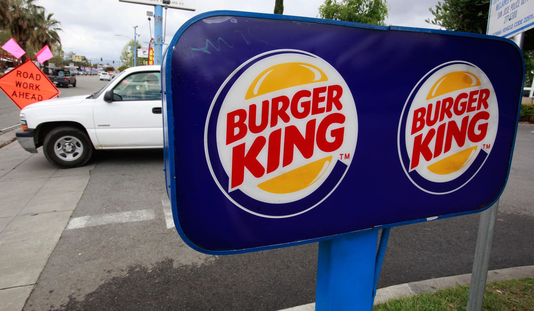 A customer leaves a Burger King in San Jose, Calif.