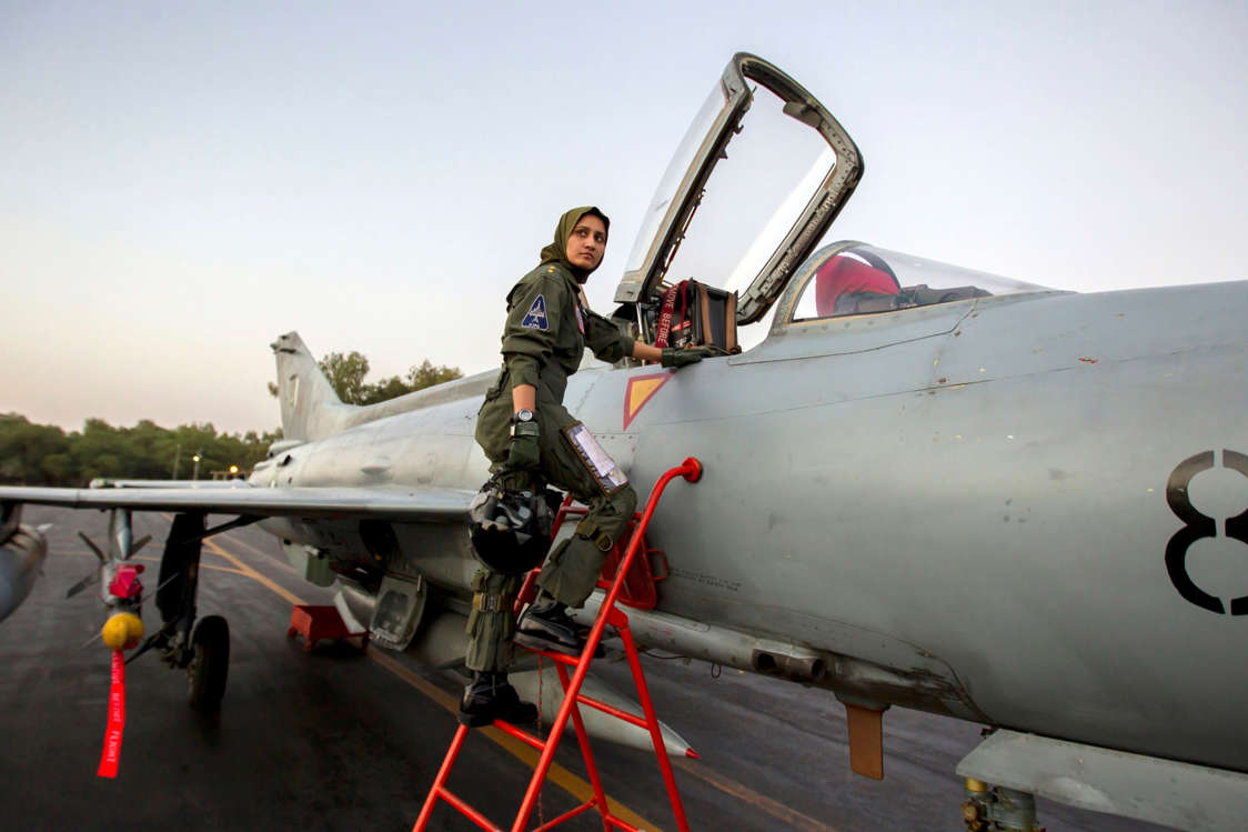 Slide 6 of 24: Ayesha Farooq, 26, Pakistan's only female war-ready fighter pilot, climbs up to a Chinese-made F-7PG fighter jet at Mushaf base in Sargodha, north Pakistan on June 6, 2013. Farooq, from Punjab province's historic city of Bahawalpur is one of 19 women who have become pilots in the Pakistan Air Force over the last decade - there are five other female fighter pilots, but they have yet to take the final tests to qualify for combat.