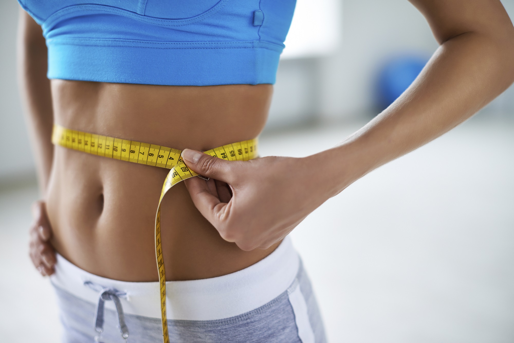 Woman measuring waist
